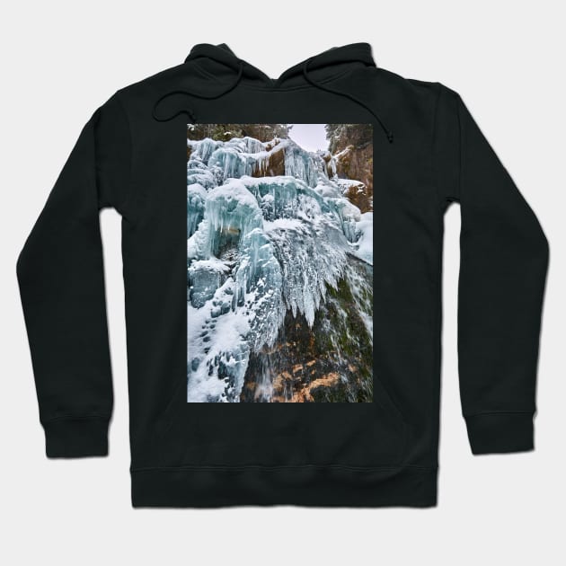 Frozen waterfall in the winter Hoodie by naturalis